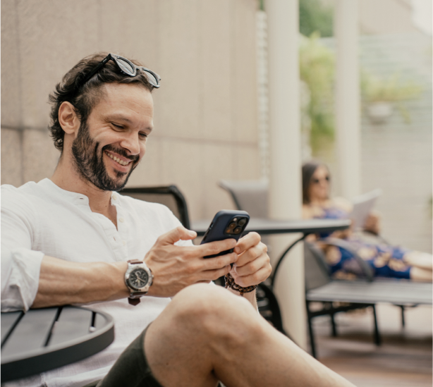 man using mobile phone to browse internet